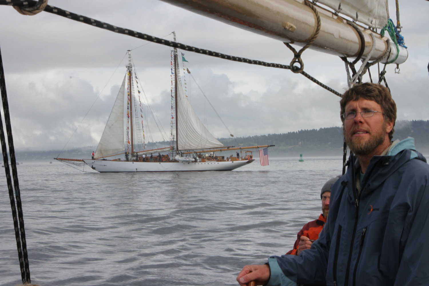 Aaron Wenholz, of Poulsbo, captains the 72-foot schooner Red Jacket as the much-larger 133-foot Adventuress comes about astern.